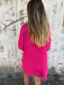 Back view of a vibrant fuchsia oversized crinkle linen shirt for women