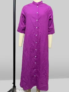 Purple long-sleeved cotton linen shirt dress with front buttons and pockets on mannequin