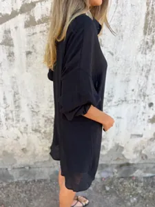 Side view of a casual black crinkled cotton linen shirt for women, loose fit style