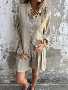 Close-up detail of women's beige cotton linen crinkle long sleeve shirt and shorts set