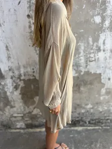 Side view of beige cotton linen crinkle long sleeve shirt showing fabric texture