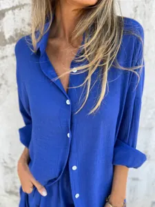 Close-up of royal blue crinkle cotton linen shirt showing button detail and texture
