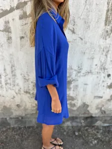 Side view of vibrant blue linen-blend button-up shirt with premium crinkled texture