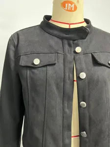 Detailed view of black faux suede women's short jacket showing textured fabric and buttons