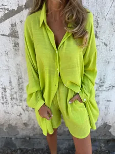 Detail of a bright lime green crinkle shirt and shorts set for a casual summer look.