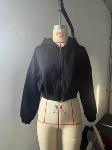 Front view of black cropped fleece zip-up hoodie on mannequin showing classic fit