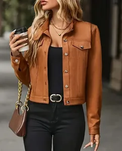 Detailed view of women's short brown suede jacket featuring metal buttons and chic style