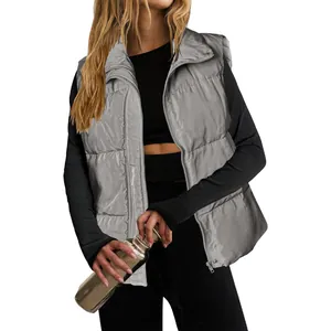 Elegant silver metallic women's quilted puffer vest with stand collar and front zipper closure