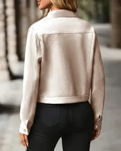 Back view of women's short suede jacket in champagne beige with metal button cuffs