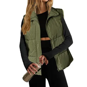 Detail view of women's olive green padded vest with stand collar and front zipper