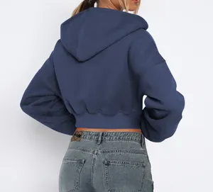 Detailed back view of a navy blue cropped fleece hoodie with a minimalist street style
