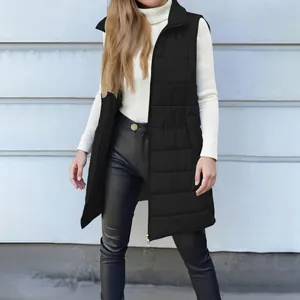 Full-length detail of a women's black long puffer vest with zipper and functional pockets.