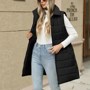 Detail view of a women's long black puffer vest featuring a quilted pattern and zipper.