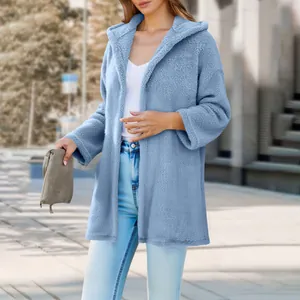 Close-up view of a cozy light blue plush hooded cardigan perfect for autumn street style