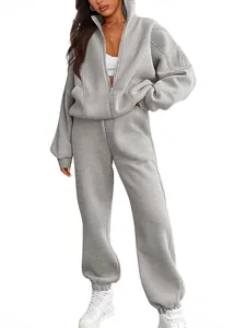 Women's casual grey oversized fleece tracksuit set with zip-up hoodie and joggers