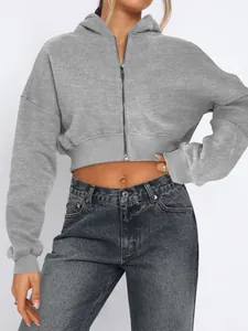 Fashionable cropped grey zip-up hoodie featuring a hood for women's streetwear look