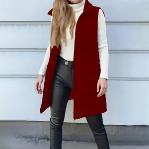 Full view of women's long red quilted puffer vest styled with black pants and white top