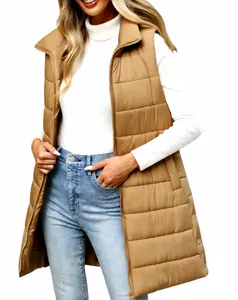 Detail view of women's long camel quilted puffer vest with front zipper pockets