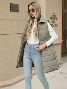 Women's long quilted puffer vest with zipper pockets in solid olive green color