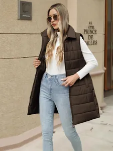 Stylish women's solid brown longline puffer vest with zipper and pockets for autumn winter