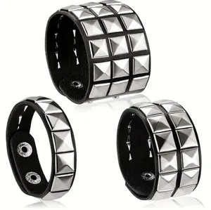 Punk black leather bracelet set with silver square pyramid studs and metal snap closure