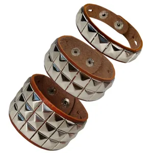 Punk leather bracelets set with silver square pyramid rivets and adjustable snaps.