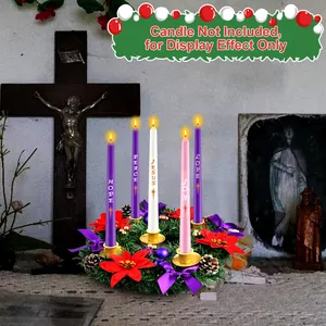 Beautiful Christmas Advent wreath with golden candle holders and red festive poinsettias