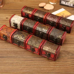 Detail view of vintage style miniature wooden treasure chest boxes with floral patterns.