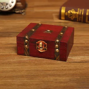 Detail view of a vintage wooden storage box with rustic metal latch and brass rivets