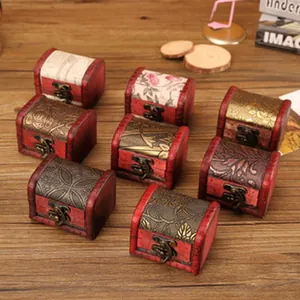 Close-up of small vintage wooden treasure chests with various patterns and metal clasps