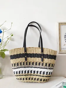 Large handmade contrast straw beach tote bag with black shoulder straps for vacation