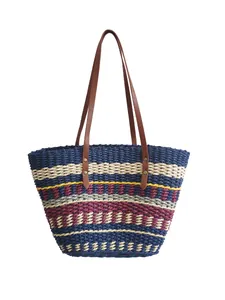 Handmade rainbow striped woven straw tote bag with brown leather handles for beach holiday