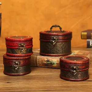 Detailed view of vintage wooden storage boxes with ornate metal latches and handles