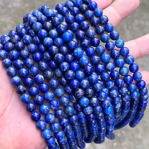 Detailed view of natural blue lapis lazuli round beads for custom DIY jewelry making