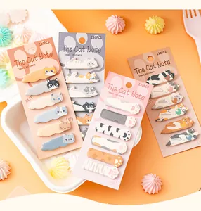 Detailed shot of cute cat-themed index stickers in four colorful packs for journaling