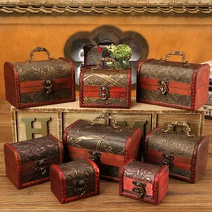 Multiple sizes of vintage wooden storage boxes with embossed patterns and metal latches