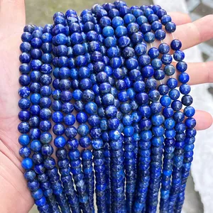 Close-up of deep blue natural lapis lazuli round beads for DIY jewelry making