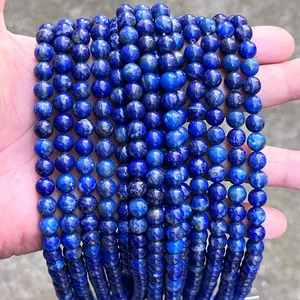 Close-up of deep blue natural lapis lazuli round beads for DIY jewelry craft making