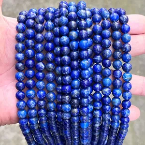 Macro detail of natural lapis lazuli round beads showing deep blue stone texture