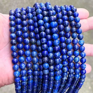 Macro view of natural Afghan lapis lazuli round beads showing deep blue mineral texture