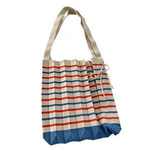 Korean style pleated knitted tote bag with red and blue stripes on white background