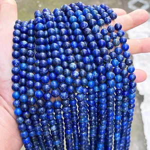 Macro detail of high-quality natural blue lapis lazuli round beads for DIY jewelry making