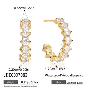 Close-up view of gold C-shaped hoop earrings with CZ stones and detailed dimensions.