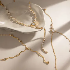 Close-up of 18k gold plated stainless steel necklaces with sparkling zircon stones
