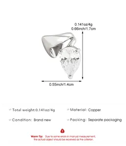 Close-up of a silver-toned pear-cut zircon ear cuff with dimensions and copper material specs
