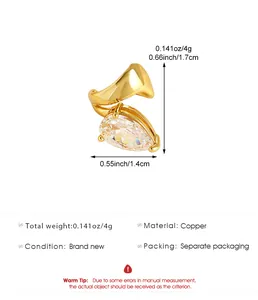 Detailed view of gold-toned ear cuff with teardrop zirconia and measurement dimensions.