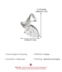 Macro detail of teardrop zircon ear cuff showing size specifications and copper material