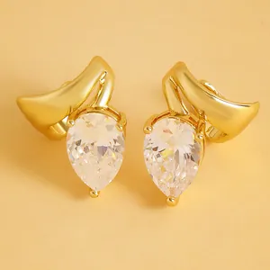 Detail view of elegant gold clip-on earrings featuring pear-cut cubic zirconia and twisted lines