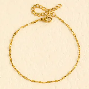 Detailed macro view showing the gold flat link design of this stainless steel anklet.