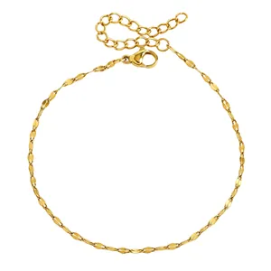 Detailed view of a gold stainless steel anklet featuring a flat rice-link chain design
